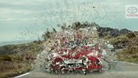 The ad featured the car bursting through a barrier