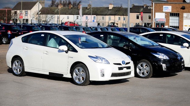 Toyota Prius hybrid cars inside a compound near a Toyota showroom in Burton on Trent
