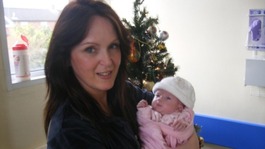 Paula Stevenson holding her daughter, Hayley Fullerton who died at Birmingham Children's Hospital one month after her first birthday