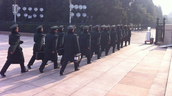 Soldiers marching outside the Great Hall of the People