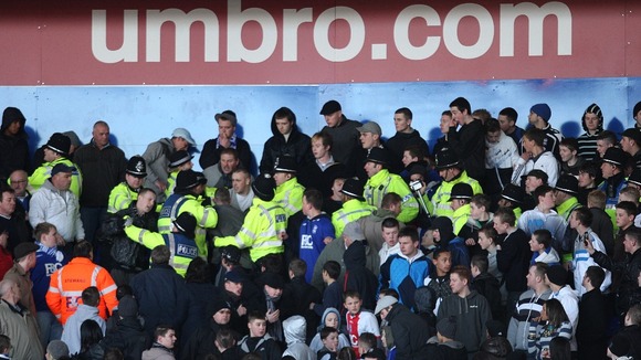 Police move in to control Birmingham City fans during Birmingham City v Burnley in St Andrews' Stadium. Picture date: 07/02/2009.