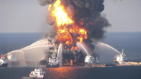 Dark clouds of smoke and fire emerge as oil burns during a controlled fire in the Gulf of Mexico, May 6, 2010.
