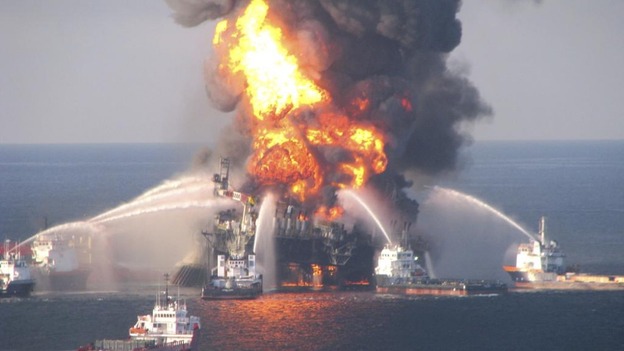 Dark clouds of smoke and fire emerge as oil burns during a controlled fire in the Gulf of Mexico, May 6, 2010.