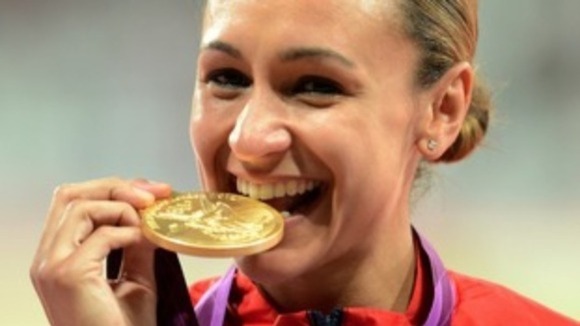 Jessica Ennis getting to grips with her gold medal at the London 2012