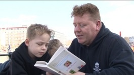 Singe Green reading with his children