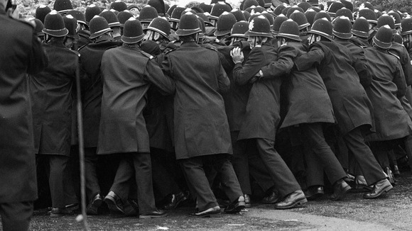 Police pushing against a section of the miners' picket outside the Orgreave Coking Plant near Rotheram in 1984.