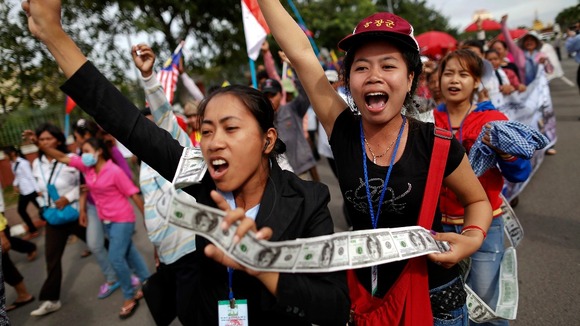 Hundreds of protesters calling for human rights gather in front of Cambodia's National Assembly building