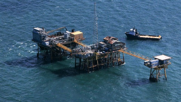 Rescue crew surrounds an oil platform which exploded early this morning in the Gulf of Mexico