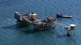  Rescue crew surrounds an oil platform which exploded early this morning in the Gulf of Mexico