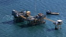 Rescue crew surrounds an oil platform which exploded early this morning in the Gulf of Mexico