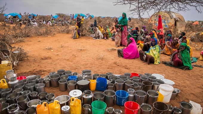 People wait for food and water as a drought hits the region