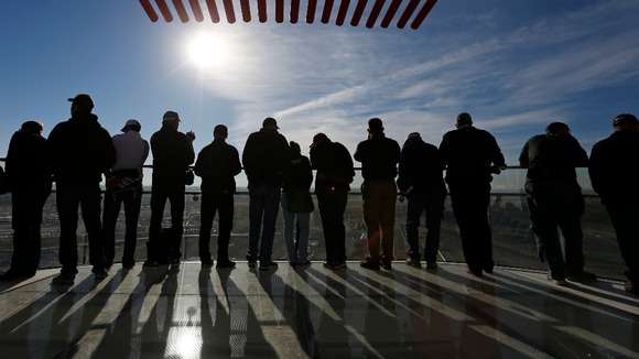 Racegoers watch the third practice session of the US F1 Grand Prix