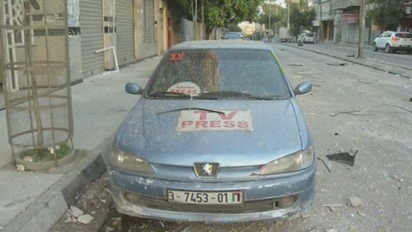 A vehicle shown outside a building housing journalists after the air strike