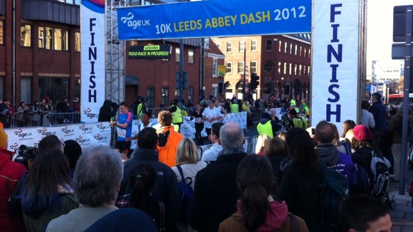 Runners pass the finish line