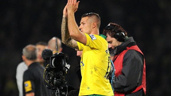 Norwich City's Anthony Pilkington celebrates victory after the final whistle during the Barclays Premier League match at Carrow Road