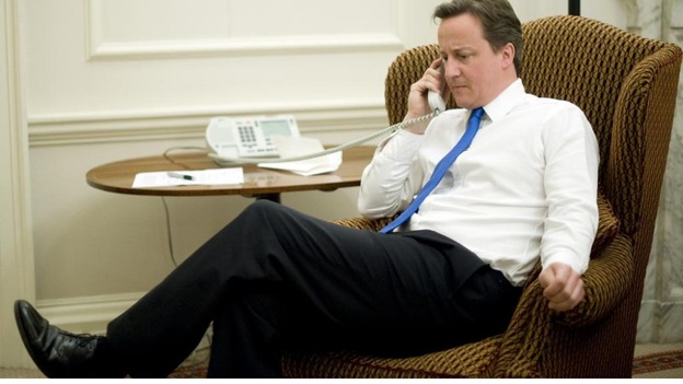 A library photo of David Cameron on the phone