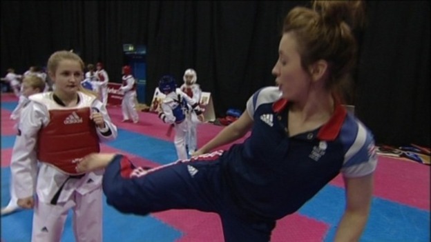 Jade Jones shows a Spennymoor Taekwondo student some of her moves