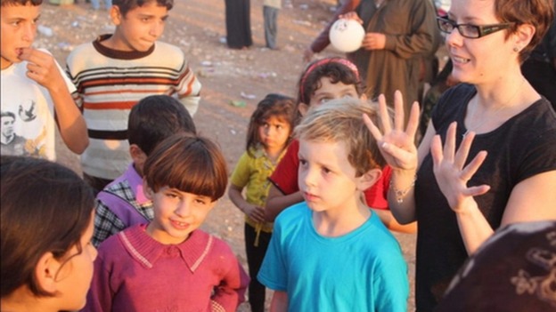 Joseph Purcell meeting children in Syria.