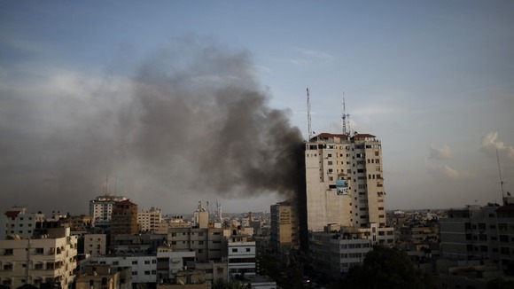 Smoke rises after an Israeli airstrike on an office that houses international media in Gaza City