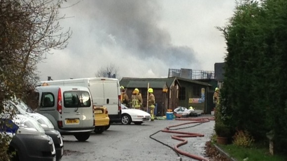 Firefighters at the scene of the oil fire