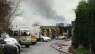 Firefighters at the scene of the oil fire