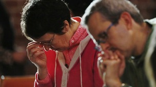 The Reverend Jane Morris prays at St Gabriels Church in Cricklewood, north London