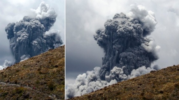 A massive plume of ash billows up into the sky as Mount Tongariro erupts