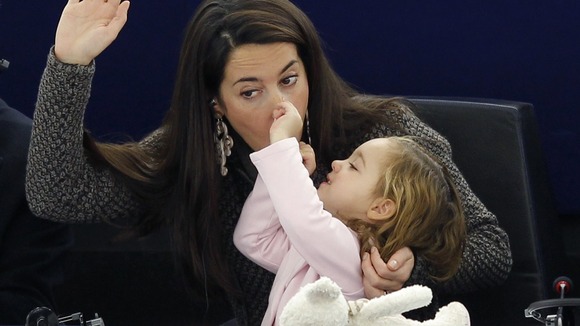 Licia Ronzulli MEP of Italy with her daughter Vittoria during a vote in Strasbourg