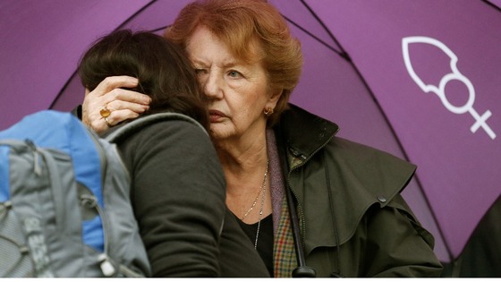 Two women hug during the vigil outside the Church of England's Church House