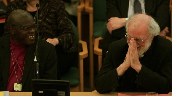 The Archbishop of York and Archbishop of Canterbury share a joke at the General Synod