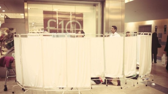 Makeshift screens outside Waitrose store in Canary Wharf where baby was born.