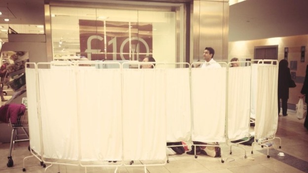 Makeshift screens outside Waitrose store in Canary Wharf where baby was born.