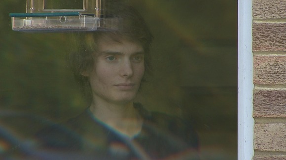 Boy looking out of window