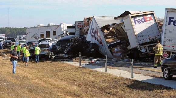 Cars and lorries stack on top of each other at the crash site