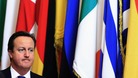 David Cameron, in front on some EU flags