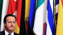 David Cameron, in front on some EU flags