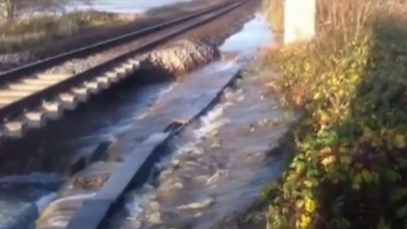 Flood waters by the side of a railway line near Axminster