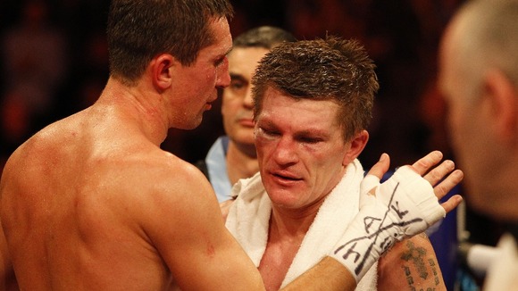 The two boxers embrace at the end of the fight.