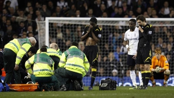 Paramedics tend to Fabrice Muamba on the football pitch.