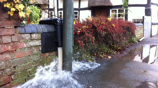 Pumping water out of a 16th century cottage in Kempsey, Worcestershire