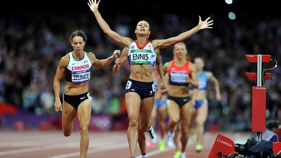 Jessica Ennis celebrates winning gold in the Women's Heptathlon after finishing the 800m at the Olympic Stadium.