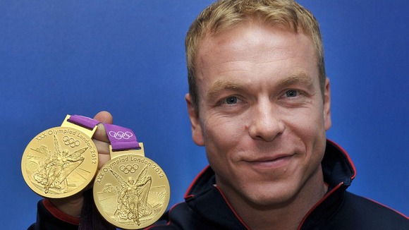 Sir Chris Hoy with his two Gold medals during a photocall at team GB House, London.