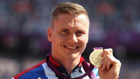 David Weir with his gold medal after winning the Men's 5000m - T54 at the Olympic Stadium, London.