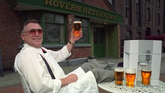 Actor Bill Tarmey, aka Coronation Street's Jack Duckworth, raises a pint outside the Rovers Return