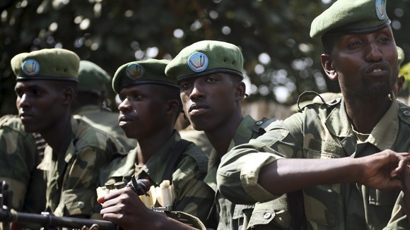 FARDC soldiers sit in a military truck in Minova, west of Goma