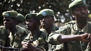 FARDC soldiers sit in a military truck in Minova, west of Goma