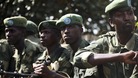 FARDC soldiers sit in a military truck in Minova, west of Goma
