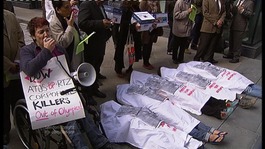 Protesters lying on the ground.