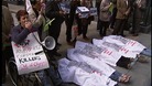 Protesters lying on the ground.