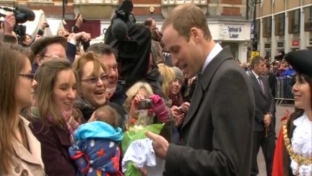 Prince William talks to mum and baby.